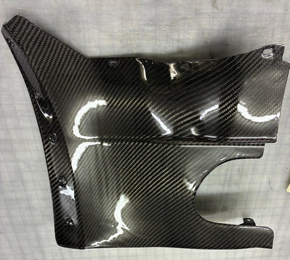 Carbon fiber panel on a gray surface