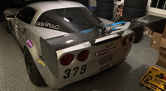 Racing car with number 379 in a garage setting